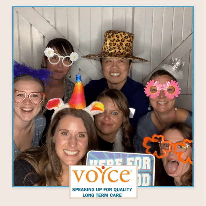 VOYCE staff pose with props