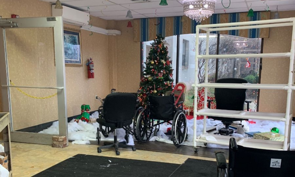 the lobby of northview village nursing facility, trashed after its closure on December 15, 2023, with wheelchairs and debris strewn about